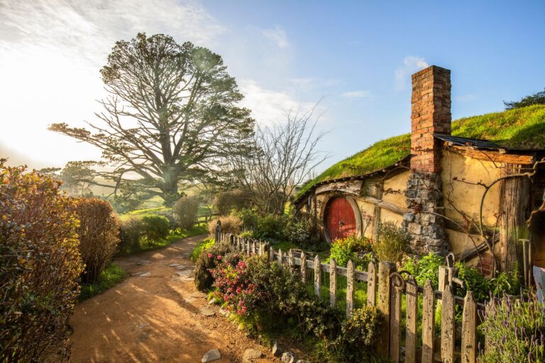 Hobbiton at Sunset - The Shire comes alive as golden hour illuminates the rolling hills of Hobbiton